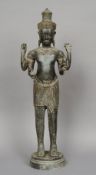 A large Thai bronze figure of a four armed deity 
Modelled standing, in an ornate headdress, each