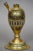 A Middle Eastern brass cased hookah base
Of ornate form, standing on a domed spreading foot.  30