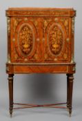A French marquetry inlaid and ormolu mounted side cabinet
The twin panelled doors above a central