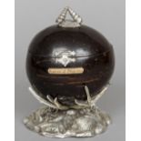A 19th century silver plate mounted coconut on stand
The nut cut and hinged to form a box with a