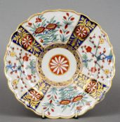 A 19th century Worcester plate
With shaped rim and decorated in the Imari palette, blue painted