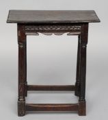 An 18th century and later oak joint stool
The moulded rectangular top above a carved frieze,