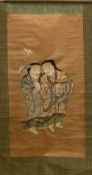 A late 19th/early 20th century Chinese silk work scroll
Centred with two figures, one holding