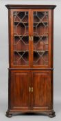 A George III mahogany standing corner cupboard
The top section with twin astragal glazed doors