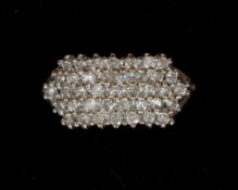 A 9 ct gold diamond set cluster ring
Set as five bands of small diamonds. CONDITION REPORTS: Overall