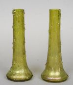 A pair of iridescent Art glass vases
Of slim naturalistic bark effect.  Each 19.5 cm high.  (2)