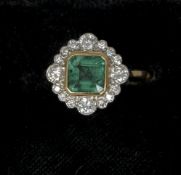 An Art Deco 18 ct gold and platinum emerald and diamond set ring
The central emerald flanked by a