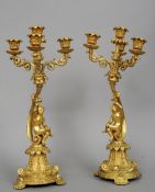 A pair of rococo style gilt bronze candelabra
Each with four sconces above the putto mounted