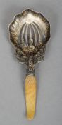 A 19th century Sterling silver ivory handled caddy spoon
The shaped bowl with pierced decoration.
