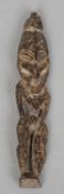 A small carved wooden tribal figure, possibly from Papua New Guinea
13.5 cm high. CONDITION REPORTS: