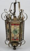 A late 19th/early 20th century brass framed hanging lantern
Of hexagonal form with stained glass