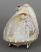 A Victorian cameo relief carved conch shell
The top decorated with a classical scene, the