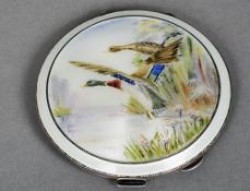 A silver and enamel decorated compact, hallmarked Birmingham 1957, maker's mark of Garrard & Co. Ltd