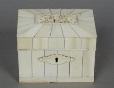 A Victorian ivory card box
The hinged domed lid carved with floral motifs and four playing cards,