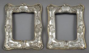 A pair of Art Nouveau silver photograph frames, probably hallmarked for Sheffield 1911, makers marks