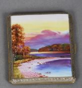 A gilt metal and enamel decorated cigarette case
The hinged cover worked with a highland landscape.