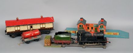 An assembled railway set, including a collection O gauge rolling stock, various makers including