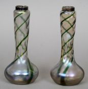 A pair of silver rimmed iridescent Art glass vases
Each decorated with twisting green bands.  Each