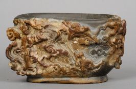 A 19th/early 20th century Chinese carved duan stone vessel
The exterior decorated with a figure