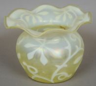 An Art Nouveau Vaseline glass vase 
Decorated with stylised floral decoration.  23 cm diameter.
