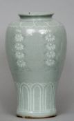 A 19th century Korean Choson Dynasty celadon glazed vase
Of baluster form with inlaid slip