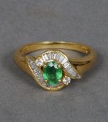 An 18 ct gold emerald and diamond ring