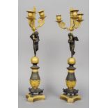 A pair of 18th century Empire ormolu mounted bronze candelabra
Each with three branches held by a