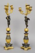 A pair of 18th century Empire ormolu mounted bronze candelabra
Each with three branches held by a