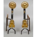 A pair of late 19th century brass and wrought iron andirons
Each headed with pierced brass