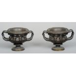 A pair of mid 19th century Continental patinated bronze albani vases, after the antique marble