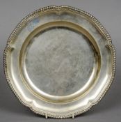 A George III silver dinner plate, hallmarked London 1814, maker's mark of William Turner
The