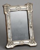 An Art Nouveau silver photograph frame, hallmarked Birmingham 1908, maker's mark of JA & S
With