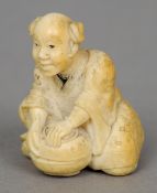 A small 19th century Japanese ivory okimono
Formed as a crouching gentleman sealing a pot.  4.5 cm