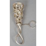 A white metal posy holder
The pierced basket filigree worked, the loop handle entwined.  11.5 cm
