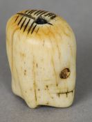 A carved bone memento mori skull
One side with the face of Christ the other opposing a skull.  2.5