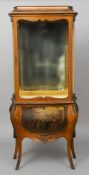 A Louis XV style Vernis Martin type vitrine
Of bombe form with a glazed upper display section