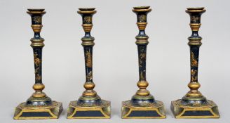 A set of four late 19th/early 20th century chinoiserie lacquered candlesticks
Each decorated on a