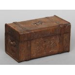 A 19th century Continental carved wooden box
Formed as a travelling trunk with floral decoration.