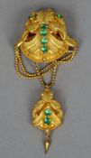 A 19th century coloured paste set pendant brooch
Formed as scrolling leaves, the pendant en