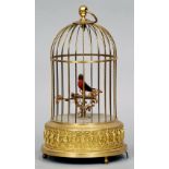 A bird cage form automaton
The brass cage enclosing a bird on a perch, the underside inscribed