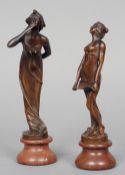 Two Art Nouveau style patinated bronze figurines
Each mounted on a rouge marble pedestal base.