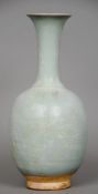 A Chinese porcelain baluster vase
With elongated flared neck and mottled turquoise decoration.  35