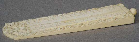 A 19th century Cantonese carved ivory peg board
Of typical form, the border carved with dragons.  19