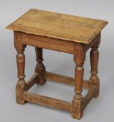 An oak joint stool
The moulded rectangular top above a plain frieze, standing on turned and block