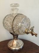 A silver mounted cut glass presentation spirit dispensing barrel, hallmarked for London, date and