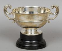 A silver twin handled trophy rose bowl, hallmarked London, date letter indistinct, maker's mark of