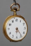 A Victorian 18 ct gold cased fob watch
The reverse with scrolling embossed decoration, the white