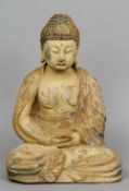 A carved wood and polychrome decorated figure of Buddha
Typically modelled.  42 cms high.