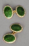 A pair of 18 ct gold enamelled decorated cufflinks
Each of oval form with green and white