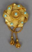 A 19th century turquoise set Pinchbeck brooch
Formed as entwined ribbons with a pair of bell